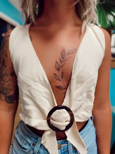 a woman with a tattoo on her chest