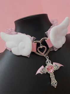 Elevate your Kawaii fashion game with our rhinestoned cross pendant blue/pink Jirai Kei angel wings PU choker. This stunning choker features a delicate PU leather band adorned with a rhinestoned cross pendant in a choice of blue or pink, perfectly capturing the ethereal essence of Jirai Kei style. The angel wings design adds a touch of whimsy and fantasy, making it a must-have accessory for any Kawaii wardrobe.  Please note that this product includes the choker only. Harajuku Style Choker Necklace As Gift, Pink Harajuku Style Jewelry For Parties, Pink Gothic Jewelry, Pastel Goth Jewelry, Pink Wings Angel, Emo Pink Aesthetic, Cutecore Accessories, Jirai Kei Art, Angel Moodboard