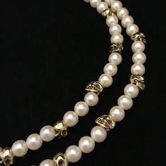 This necklace is a combination of new and vintage pieces. Circa 1960 faux pearls are mixed with twenty contemporary, gold plated skull beads. The skulls and pearls are both about the same size, 3/8 inch, or 8 mm. It has been strung on thick beading wire and both strands end in a vintage, gold plated closure component original to the necklace. A raw brass skull has been added to the large, 1 inch tongue in socket closure. It is a double strand necklace measuring 16 and 17 inches.  There are twent Handmade Double Strand Pearl Jewelry, Formal Multi-strand Pearl Charm Necklace, Formal Multi-strand Necklace With Pearl Charm, Formal Double Strand Metal Jewelry, Single Strand Pearl Jewelry For Party, Dainty Metal Jewelry With Pearl Charm, Double Strand Pearl White Jewelry As Gift, Pearl White Double Strand Jewelry Gift, Formal Metal Jewelry With Pearl Chain