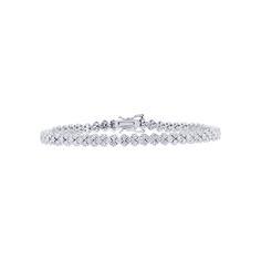 Add a touch of elegance and sophistication to your look with the Jagger Diamond Tennis Bracelet 3 5/8ct from Steven Singer Jewelers. This exquisite bracelet is crafted from 18-karat gold and features approximately 3 5/8 carats total weight of well-matched round brilliant diamonds. The diamonds are perfectly set to create a stunning tennis bracelet design that will elevate any outfit. The Jagger Diamond Tennis Bracelet is a true masterpiece from Steven Singer Jewelers, perfect for those who appre Diamond Tennis Bracelet, Bracelet Design, Tennis Bracelet Diamond, Top Gifts, Brilliant Diamond, Tennis Bracelet, Bracelet Designs, Round Brilliant, Everyday Look