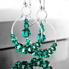 Dainty, emerald green hoop earrings featuring RARE Swarovski crystals beaded onto sparking Sterling silver hoops and suspended from Sterling silver ear-wires.  Nice gift idea for May birthday Lady :)  More details: - ALL .925 Sterling silver - handcrafted hook ear-wires, textured 20mm hoops and links  - Brilliant, faceted Swarovski crystal (3-6mm)  - The earrings are approx. 1 3/4" (43 mm) in total length Here, you can view more EMERALD GREEN jewelry, in my shop: https://www.etsy.com/shop/DorotaJewelry?ref=hdr_shop_menu&search_query=emerald Here, you can view HOOP EARRINGS, in my shop: https://www.etsy.com/shop/DorotaJewelry?ref=hdr_shop_menu&search_query=hoop+earrings --- Please, keep in mind that the jewelry in the photographs looks larger than it does in person. I post close up pictures Green Hoop Earrings, Birthday Lady, Emerald Green Jewelry, Emerald Green Crystal, Emerald Crystal, Earring Making, Crystal Hoop Earrings, Business Products, Green Jewelry