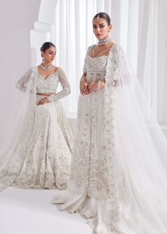 Bridal Lehenga Kameez White Pakistani Wedding Dress is an elegant attire that will give you a head-turning look on the most important day of your life. Lavish designs and perfect stitching make this Pakistani Bridal Dress a perfect choice to wear on the Nikkah day. Lehenga Kameez: The kameez in premium net fabric is intricately emblazoned with zardosi, motifs, and embroidery. This kameez in an alluring white shade is adorned with heavily embellished silverwork, naqshi, stones, sequins, and beami White Pakistani Wedding Dress, Lehenga Kameez, White Bridal Lehenga, Fawad Khan, Pakistani Bridal Dress, Bridal Dupatta, Pakistani Wedding Dress, Lehenga Style, Elegant Attire