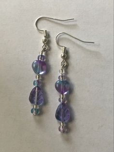 These are available on my Etsy! Check out the link to my website in my bio! Purple Dangle Earrings With Beads, Purple Dangle Beaded Earrings Wire Wrapped, Purple Wire Wrapped Beaded Dangle Earrings, Purple Dangle Earrings With Tiny Beads, Purple Dangling Bead Earrings, Purple Diy, Diy Wire Earrings, Earrings Ideas, Diy Jewelry Unique