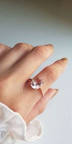 RING DETAILS: ✪Design: Gold ring ✪Gemstone: AA Morganite ✪Gemstone color: Pink ✪Gemstone shape: Oval ✪Gemstone transparency: Transparent ✪Gemstone size: Morganite- 9X11mm ✪Gemstone weight: Morganite- 3 carat ✪Setting type: Prong setting ✪Metal type: 14k rose solid gold ✪Gold weight: 2.13 gm ✪Metal finish: Smooth shiny Choose your ring size from drop down menu and if you need any other preferred ring size please contact us. QUALITY OF MATERIALS: Metal: Most of our jewelry at JewelryMansion is mad Oval Morganite Wedding Ring With Brilliant Cut, Morganite Solitaire Ring In Rose Gold, Rose Gold Morganite Solitaire Ring, Delicate Morganite Round Rings, Eco-friendly Morganite Diamond Ring, Solitaire Morganite Oval Ring, Classic Oval Morganite Ring, Morganite Rings With Prong Setting For Proposal, Oval Morganite Jewelry For Proposal