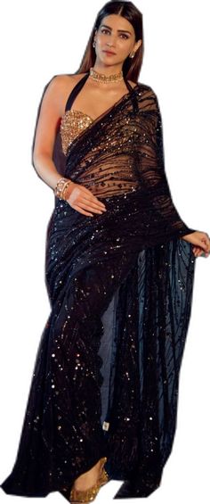 Glamorous Sequined Pre-draped Saree For Festivals, Party Wear Pre-draped Sequined Saree For Festivals, Embellished Black Pre-draped Saree For Party, Festive Black Pre-draped Saree With Sequins, Bollywood Style Pre-draped Saree With Sequins, Party Wear Pre-draped Saree With Sequins For Evening, Black Pre-draped Saree With Resham Embroidery, Black Sequined Pre-draped Saree, Black Georgette Bollywood Pre-draped Saree