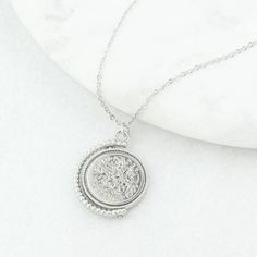 "A lucky sixpence spinner necklace displaying a genuine polished 1962 sixpence coin. Featuring a genuine 1962 sixpence coin, this vintage inspired necklace makes for a memorable and thoughtful gift for anyone celebrating a 60 year milestone. NOTE: the images show 1960 sixpence but you will receive a 1962 coin. The sixpence is traditionally given as a symbol of good luck so would make a fantastic gift for a wedding, birthday or any other special occasion. It is something that can be worn and kept Classic Charm Necklaces With Coin Pendant, Anniversary Coin Necklace Nickel Free, Classic Coin Necklace For Gifting, Classic Coin Necklace As A Gift, Classic Coin Necklace For Gift, Timeless Round Coin Necklace As Gift, Classic Medallion Necklace With Coin Pendant As Gift, Anniversary Medallion Necklace With Coin Pendant, Anniversary Round Medallion Necklace With Coin Pendant