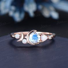 I LOVE YOU TO THE MOON AND BACK RING 5mm Round Natural Rainbow Moonstone Opal Celestial Moon Engagement Ring Cluster Opal Wedding Ring Personalized Handcrafted Birthday Gifts The waning moon is believed to be a good time for clearing negative influences. This simple, ready to wear ring allows you to keep the spirit of the moon with you always. The moon engagement rings are a popular choice, represents I LOVE YOU TO THE MOON AND BACK , used to express the vastness of one's affection for another. 30 days non-hassle return policy. For returned items, there may be handcrafting and shipping fee deducted.  DETAILS: - Material : 925 Sterling Silver (Hypoallergenic, Nickel Free, Tarnish Resistant)Solid 14k/18k gold,platinum PLEASE choose silver or platinum if you are allergic to nickel. - Main sto Crescent Moonstone Ring For Anniversary, Crescent Moonstone Anniversary Ring, Celestial Crescent Moonstone Ring For Anniversary, Celestial Moonstone Ring With Moon Phase For Anniversary, White Moonstone Ring With Moon Phase For Anniversary, Wedding Crescent Moonstone Ring With Moon Phase, Moon Shaped Celestial Moonstone Ring For Anniversary, Crescent Moonstone Jewelry For Anniversary, Celestial Moonstone Ring With Moon Phase For Wedding