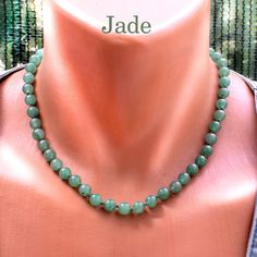 Elevate your style with this exquisite Jade Necklace, featuring about 8mm round gemstone beads. Crafted with precision and care, each bead showcases the natural beauty and unique patterns of jade, making every piece one-of-a-kind. The necklace is expertly tied on a green thread with knots between the beads and finished with a secure clasp, ensuring both elegance and durability. Add a touch of sophistication to any outfit with this timeless jade jewelry. Necklace length 18 in + 2 in Extender /up Jade Gemstone Beaded Necklaces With Round Beads, Jade Gemstone Beaded Necklace With Round Beads, Elegant Jade Beaded Necklace With 8mm Beads, Jade Beaded Necklaces With Gemstone Beads, Beaded Jade Necklaces With Gemstone Beads, Jade Beaded Necklace With Gemstone Beads, Jade Beaded Necklaces With 8mm Beads, Jade Beaded Necklaces With 8mm Round Beads, Jade Necklaces With Faceted Round Beads