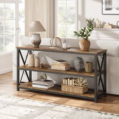 a living room scene with focus on the bookshelf and table in the foreground