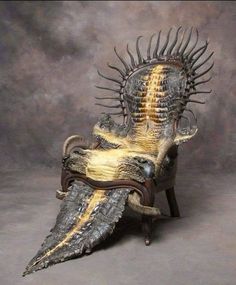 a chair made out of an alligator's skin with spikes on the back and legs