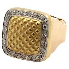 a gold and diamond ring with an intricate design on the front, set in 18k yellow gold