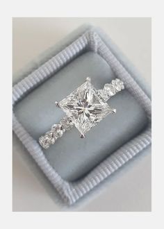 an engagement ring in a gift box