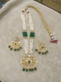 All our pieces are in stock and will be dispatched within 24 to 48 hours of order. Orders received during the weekend will be dispatched on Monday The white and green beads strings on both sides of an elegant Kundan pendant make it a statement wedding necklace. One of our favorite picks for the wedding season 2022❤️ The drop length of the necklace: is approximately 11 inches, and comes with an adjustable string. Length of Earrings: 2 inches Jewellery Set Bridal, Wedding Jewellery Set, Statement Earrings Wedding, Bridal Necklace Set, Green Beads, Kundan Necklaces, Wedding Jewellery, Earrings Wedding, Jewellery Set