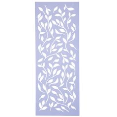 a decorative stencil with leaves and vines in white on a purple background,