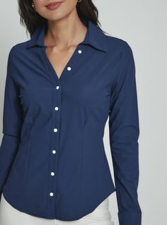 The Luxe Blouse features 4-Way Stretch fabrication that is both moisture-wicking and wrinkle free. This is a flattering semi-fitted blouse designed with mother of pearl buttons for a sophisticated look. Perfect for the office or a fancy dinner on the weekend. Details Model is 5'10" and wears a size small. Care: Machine wash cold on delicate cycle with similar colors. Do not bleach. Dry flat. Do not dry clean. Cold hand wash for best results. Composition: 78% Nylon | 22% Spandex Luxury Fitted Button-up Blouse, Fitted Blouse With 3/4 Sleeves And Button Cuffs, Chic 3/4 Sleeve Blouse With Button Cuffs, Elegant 3/4 Sleeve Blouse With Button Cuffs, Blue 3/4 Sleeve Blouse With Button Closure, Fancy Dinner, Red Pants, Wrinkle Free, Mother Of Pearl Buttons