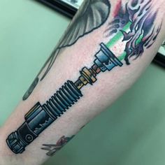 a man with a tattoo on his arm has an engine in the shape of a rocket ship