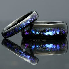 ►Material: Tungsten Carbide and Crushed Sandstone Inlay ►Color: Black Tungsten and Nebula Inspired Inlay ►Comfort Fit ►His Band Width: 8mm ►Her Band Width: 4mm ►Fit is true to size for His and Her bands ►This ring is inspired by the beautiful Orion nebula shown above. The color shifting blue-purple sandstone resemble gases of the nebula amongst a sea of stars. A beautiful alternative for a wedding band, this ring will stand out amongst the crowd of standard wedding bands. ►Sandstone is known for Celestial Wedding Rings With Polished Finish, Silver Titanium Wedding Rings, Formal Titanium Jewelry, Titanium Wedding Rings With Polished Finish, Wedding Titanium Rings With Polished Finish, Space Rings, Couples Ring, Gothic Wedding Dress, Orion Nebula