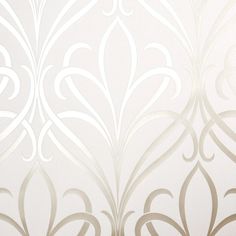 a white wallpaper with silver swirls on it