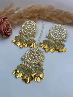 Kundan tikka set . Available in 3 beautiful colours.  Goes with traditional Indian dress , saree.   Necklace size- one size  Necklace width- 2 inches approximately  Earrings length - 2.5 inches  Tikka width- 1.5 inches approximately  Style tip- ----------- Pair it with any beautiful traditional outfits  and flaunt with Unique style of collection from us. Perfect match for Festival and Traditional wear.  Take Care Tips-  ---------------- Kee away from perfume, Hair spray and. Moisture.  Store in Kundan Danglers With Mirror Work, Multicolor Kundan Chandbalis With Gota Work, Saree Necklace, Kundan Jhumka, Dress Saree, Jewelry Kundan, Kundan Jewellery Set, Kundan Necklace Set, Kundan Jewelry