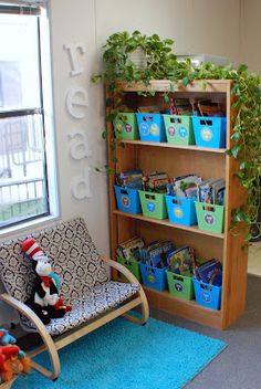 a child's room with toys and bookshelves in front of a window