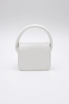 Bethany Micro Mini Bag This product has been hand-picked by Storets' stylists. White Tote Baguette Bag For Shopping, White Baguette Tote Bag For Shopping, White Square Bag With Adjustable Strap, White Double Handle Baguette Bag For Errands, Modern White Box Bag With Handles, Modern White Tote Baguette Bag, Modern White Top Handle Baguette Bag, White Baguette Tote Bag For Errands, Modern White Bag With Round Handle