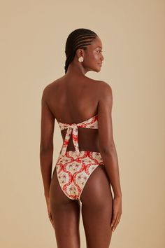 Embrace the vibrancy of summer with the FARM Rio Summer Beach Bikini Bottom. Its vivacious red and white pattern draws inspiration from tropical havens, making every moment feel like a sunny escape. The flattering high-leg cut and comfortable mid-rise waist complement your natural silhouette, while the playful tie-back detail on the coordinating top adds a touch of whimsy to your beach ensemble. Ideal for those who love to stand out with a touch of Brazilian flair. Composition 85% POLYAMIDE 15% ELASTANECare Instructions MAXIMUM WASHING TEMPERATURE 30°C, MILD PROCESS, DO NOT BLEACH, TUMBLE DRYING POSSIBLE, DO NOT IRON, DO NOT DRY CLEANSize and Fit Inches XXS XS S M L XL Bust N/A N/A N/A N/A N/A N/A Waist 22 25 27 28 30 31 Length N/A N/A N/A N/A N/A N/A Hip 34 37 39 40 43 43 Unique Bow Tie, Radiate Confidence, Tropical Pattern, Farm Rio, Beach Days, Beach Day, Summer Days, Summer Beach, Bow Tie