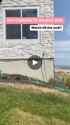 a man is standing in front of a house with a hose attached to the side of it