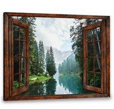 an open window overlooking a mountain lake with trees in the foreground and mountains in the background