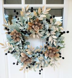 a wreath is hanging on the front door