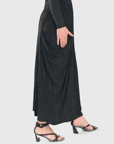 This versatile, ankle-skimming beauty will elevate your wardrobe options as a reliable go-to for any occasion. Delicious crinkle crepe in an effortless pull-on silhouette with Hagar's signature draped pocket on the side. All-around stretch waist, straight hem. Missy & Plus sizes Katya is 5'9" & wears Alembika 1 Black Draped Ruched Bottoms, Flowy Draped Skirt For Evening, Evening Flowy Draped Skirt, Chic Draped Gathered Skirt, Ruched Draped Flowy Skirt, Draped Flowy Ruched Bottoms, Chic Draped Bottoms With Folds, Spring Draped Bottoms With Folds, Voluminous Long Ruched Skirt