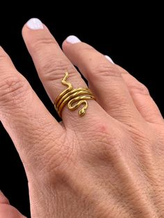 Adjustable Stainless steel gold ring. It doesn't change color with use. very resistant to erosion. USA size 6-7.5 Gold Minimalist Snake Ring For Promise, Elegant Gold Snake Ring In Brass, Gold Minimalist Snake Ring As Promise Ring, Elegant Gold Brass Snake Ring, Gold Open Snake Ring, Yellow Gold Brass Snake Ring As Gift, Yellow Gold Brass Snake Ring For Gift, Adjustable Gold Snake Ring, Gold Snake Ring As Gift