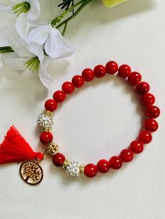 Beautiful handmade red glass bead bracelet with golden tassel charm with stretchable cord . size : fit for 7" to 8.5" inch wrist 1 piece  Color option Available Ready to ship with eco friendly packaging. Cheap Handmade Red Charm Bracelet, Red Spiritual Beaded Bracelets As Gift, Spiritual Red Beaded Bracelets As Gift, Spiritual Red Beaded Bracelets For Gift, Adjustable Red Beaded Bracelets For Meditation, Red Beaded Bracelets For Meditation 8mm, Red Bracelets With 8mm Beads For Meditation, Red Meditation Bracelets With 8mm Beads, Red Beaded Bracelets With 8mm Beads For Gift