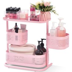 a pink shelf with two shelves holding cosmetics and toiletries