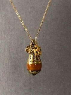 Give or have this necklace to guide you to the right direction to the enlightenment. This will make a great gift to whom are searching for true self and wisdom. *Orange Resin Pendant measures 38mm x 15mm ---------------------------------------- https://www.etsy.com/listing/111962735/yoga-jewelry-tibetan-bead-jewelry-pearl?ref=shop_home_active_2 ---------------------------------------- *JEWELRY CARD OPTIONS* Please indicate your choice of a message or your personals message in the 'message to sel Holistic Jewelry With 108 Beads For Gift, Gold Necklace With Natural Stones And Flower Pendant, Spiritual Good Luck Necklace With Round Shape, Spiritual Round Good Luck Necklaces, Good Luck Spiritual Necklace With Round Shape, Spiritual Good Luck Round Necklace, Spiritual Medallion Pendant Necklace With Charms, Bohemian Charm Necklace With Round Pendant For Gifts, Bronze Bohemian Locket Necklace