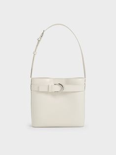 Made for the new season ahead, it is time to swap out your woven basket bag for a versatile bucket bag. Offering the right blend of slouch and structure, this Gabine bucket bag with an all-white finish is the perfect work-to-weekend carrier that you can pair with most outfits. Crafted in box calf leather, this bag exude a subtle shine and is made to last complete. Plus, the thick shoulder strap ensures the bag will sit comfortably on your shoulder. Afterpay Day, Charles Keith, Woven Basket, Basket Bag, Arm Candy, Kids Gifts, White Bag, Leather Belt, Clothes For Sale