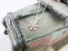 "Lovely enamel flower in pink sterling silver necklace. The chain is a diamond cut chain.   It is ideal gift for your adorable girl.  Made of good quality solid 925 sterling silver; Brand: ANKA; Length: 13, 14, 15, 16 inches available; Pendant: 1*1.6cm; \"925\" stamped; Colour as shown; In Gift Box Packing; Cleaning and polishing with sterling silver cloth after wear  Visit our etsy shop for more kid's sterling silver jewelry and also personalized sterling silver chokers and many other sterling silver everyday jewelry items. https://www.etsy.com/shop/charmplus" Sterling Silver Choker, Box Packing, Silver Choker, Flower Pendant Necklace, Enamel Flower, Silver Enamel, Necklace Sterling Silver, Everyday Jewelry, Flower Pendant