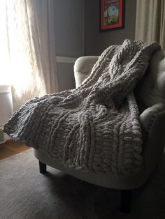 a chair with a blanket on top of it