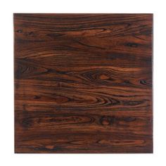 a square wooden cutting board with dark wood grains