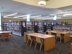 an empty library with tables and chairs