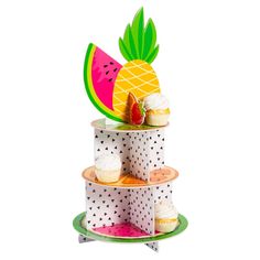 three tiered cake stand with cupcakes and watermelon