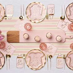 pink and gold table setting with place settings