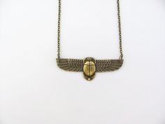 "Vintage design Egyptian Revival Scarab Pendant Necklace. Beautiful Antiqued brass. Ornate detailed Scarab, 2-3/8\" across. Antiqued brass finish brass chain with a lobster clasp. Handmade by me, on Maui, and sent to you with Aloha! #53 More of my Artisan Jewelry: hawaiibeads.etsy.com" Symbolic Ankh Brass Necklace, Ancient Egyptian Necklace, Scarab Beetle Necklace, Egyptian Inspired Jewelry Art Nouveau, Winged Scarab Necklace, Oxidized Brass, Art Deco Necklace, Swarovski Pearls, Style Gift