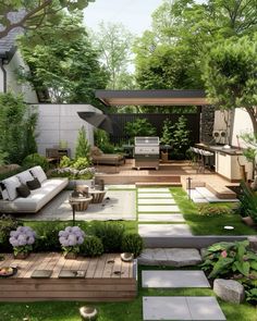 an outdoor living area with lots of furniture and plants in the grass, surrounded by trees