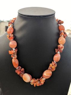 Add charm and glamour to your outfit with this strikingly beautiful handcrafted natural stone necklace in vibrant hues.Pair it up with any semi formal or casual attire and win compliments all the way.Necklace weight112 GM'sLength10 " Agate Necklaces With Natural Stones, Unique Amber Necklaces With Natural Stones, Bohemian Carnelian Beaded Necklace With Stones, Elegant Orange Beaded Necklaces With Natural Stones, Long Agate Crystal Necklace With Natural Stones, Elegant Orange Beaded Necklace With Natural Stones, Agate Beaded Necklaces For Jewelry Making, Amber Crystal Necklace With Gemstone Beads, Adjustable Natural Stone Beaded Necklaces