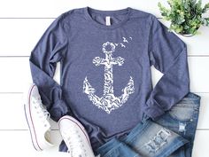 This nautical shirt is a long sleeve shirt with a button up front and anchor print on the back. Perfect for any sailor, boat captain, or marine-at-heart. This comfortable t-shirt will be your and your friends' favorite! Be simple, be different! - Long Sleeve Shirt - Youth - Toddler - Unisex M A T E R I A L S → All our simple color ones like White and Black are 100% Cotton. → All our Heathered Colors are cotton/polyester blend and they are super comfy soft! → Bella-Canvas Unisex Jersey Long Sleev Nautical Cotton Tops For Fall, Nautical Long Sleeve Tops For Summer, Nautical Style Long Sleeve Summer Tops, Navy Long Sleeve Summer T-shirt, Nautical Style Cotton T-shirt With Short Sleeves, Nautical Shirt, Nautical Cotton T-shirt With Short Sleeves, Nautical Cotton T-shirt With Graphic Print, Navy Nautical Short Sleeve T-shirt