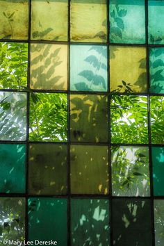 green and yellow glass tiles with leaves in the middle metal print by panoramic images