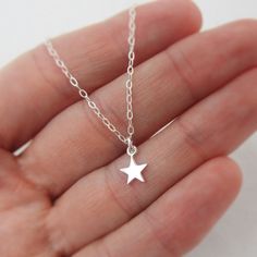 ALL STERLING SILVER - A GREAT KEEPSAKE This celestial necklace is lovingly hand-made with all solid sterling silver parts, making it a thoughtful gift (even for yourself!). A tiny shiny star dangles elegantly from the sparkly chain. Closes with an easy-to-use spring clasp. Star charm measures approximately 1/4 inch tall. Comes in a gift box, perfect for gift-giving. **SIZING - PLEASE READ: Select your necklace size at checkout. Note that necklaces will fit differently depending on a person's siz Personalized Sterling Silver Star Necklace, Personalized Star-shaped Sterling Silver Necklace, Sterling Silver Necklace With Star Charm For Gifting, Sterling Silver Necklace With Star Charm As Gift, Gift Sterling Silver Necklace With Star Charm, Sterling Silver Star Charm Necklace Nickel Free, Nickel-free Sterling Silver Star Charm Necklace, Everyday Celestial Sterling Silver Charm Necklaces, Personalized Sterling Silver Star Charm Necklace