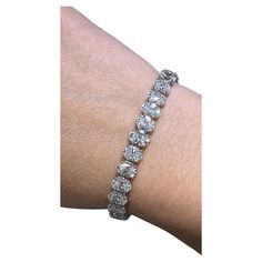 Daniella Design SKU: 127778 Oval cut diamond riviera line tennis bracelet is absolutely amazingly crafted in luxurious Platinum and made with 33 oval-cut diamonds of each GIA-certified stone 23.19carats! True fit for a queen. Everyone will gasp with a thrill when seeing it on her wrist! Metal: Platinum Diamond Weight: (33) Oval Cut Diamonds of 23.19ct t.w. Certified: All GIA-certified diamonds Diamond Details: D - F color, SI+ clarity Dimension: Width 6mm L: 17.7cm 0.70 OV DSI2 GIA#7402939763 0. Bracelet Tennis, Oval Cut Diamond, Bracelet Crafts, Gia Certified Diamonds, Tennis Bracelet, Oval Cut, Metallica, Diamond Cuts, Platinum