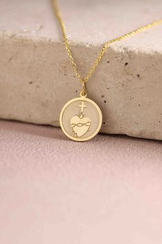 Gold Sacred Heart Pendant - Sacred Heart Gold Necklace ● Material of pendant: Solid Gold 14k ( REAL GOLD ) ● Metal Stamp: 14k ( REAL GOLD ) ● The pendant is available in 5 sizes: - 12,7 mm / 0.5 inches (Diameter) - 14,0 mm / 0,55 inches ( Diameter ) In the photos - 15,3 mm / 0.6 inches ( Diameter ) - 16,5 mm / 0,65 inches ( Diameter ) - 19,1 mm / 0,75 inches ( Diameter ) ( In the photos the size is 14mm / 0.55 inches Diameter ) ( Jump Ring inner diameter: 4 mm ) ● Material of chain: Solid gold 1 Symbolic Heart Shaped White Gold Jewelry, Valentine's Day Symbolic Heart-shaped Jewelry, Symbolic Necklace With Heart Charm For Anniversary, Symbolic Heart Charm Necklace For Anniversary, Symbolic Gold Jewelry For Valentine's Day, Symbolic Yellow Gold Heart Jewelry, 14k Gold Necklace For Valentine's Day, Yellow Gold Jewelry For Valentine's Day With Round Pendant, 14k Gold Heart Necklace Tarnish Resistant For Gift