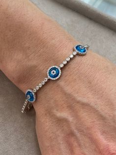 Silver Evil Eye Bracelet , Blue Stone Bracelet , Handmade Jewelry Bracelet , Good Luck Bracelet , 925K Sterling Silver Jewelry ,Gift For Him .. ★Item Details * Material : 925K Sterling Silver * Total weight : 10 Grams * Length : 18 Cm ✔ Ready to Ship in 1-2 Business Days .. ✔ Shipped to the Worldwide 1-5 business days with free shipping... ✔ The product will be sent to you with a handmade wooden box to avoid any damage during shipping... ✔ Visit our store, browse other Men's jewelry, silver and Blue Hand-set Bracelet As A Gift, Hand Set Blue Diamond Bracelet As Gift, Blue Hand Set Diamond Bracelet As Gift, Blue Sterling Silver Bracelet Jewelry, Blue Sterling Silver Bracelet, Blue Sterling Silver Round Bracelet, Blue Round Sterling Silver Bracelet, Handmade Sterling Silver Evil Eye Bracelet, Handmade Silver Evil Eye Bracelet